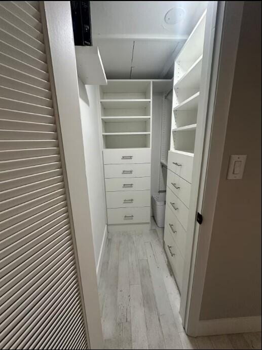 664 SE 20th Ave Unit 1, Deerfield Beach, FL 33441 - walk in closet featuring light wood-style floors