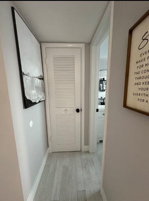 664 SE 20th Ave Unit 1, Deerfield Beach, FL 33441 - hall featuring baseboards and light wood-style floors