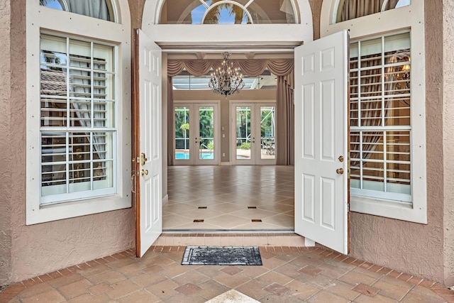11604 Kensington Ct, Boca Raton, FL 33428 - doorway to property featuring french doors and stucco siding