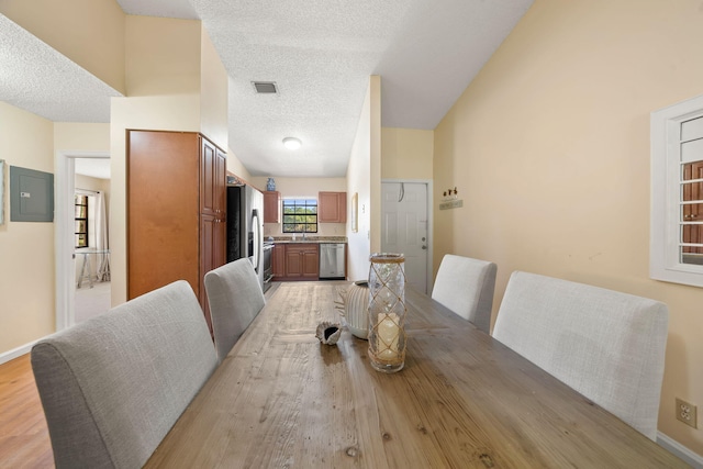 301 Norwood Ter Unit N230, Boca Raton, FL 33431 - dining room with visible vents, a textured ceiling, baseboards, and electric panel