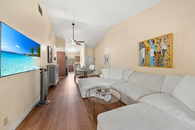 301 Norwood Ter Unit N230, Boca Raton, FL 33431 - living area featuring vaulted ceiling, baseboards, visible vents, a ceiling fan, and wood finished floors