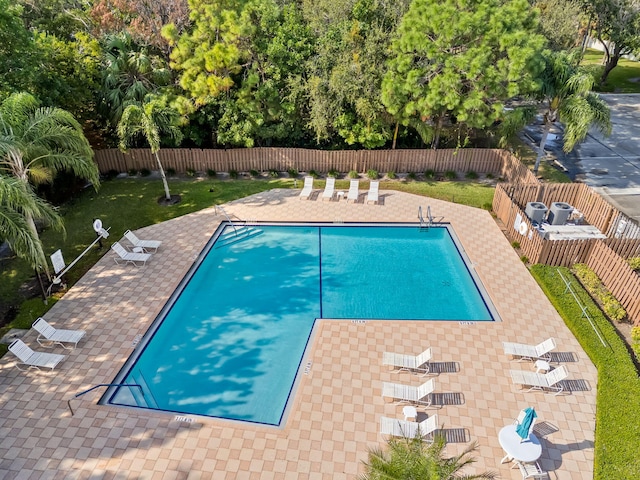 301 Norwood Ter Unit N230, Boca Raton, FL 33431 - community pool featuring a fenced backyard and a patio