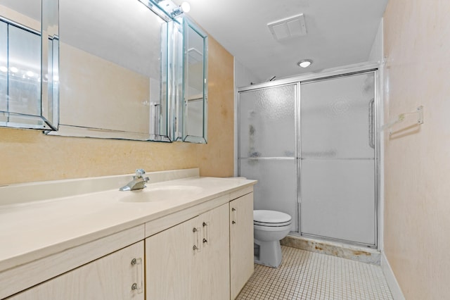 bathroom with toilet, a shower stall, tile patterned flooring, and visible vents