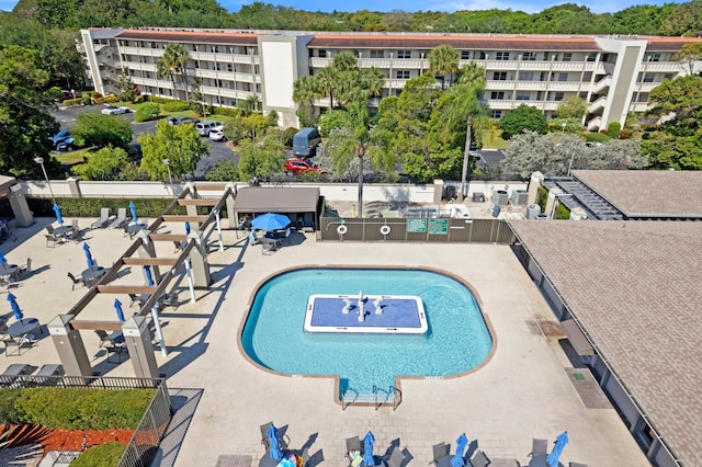 view of pool featuring fence