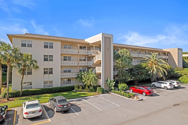 view of property with uncovered parking