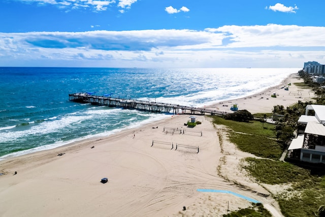 aerial view featuring a water view and a beach view