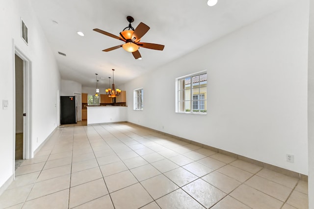 9827 Galleon Dr, West Palm Beach, FL 33411 - spare room with light tile patterned floors, visible vents, recessed lighting, and ceiling fan with notable chandelier