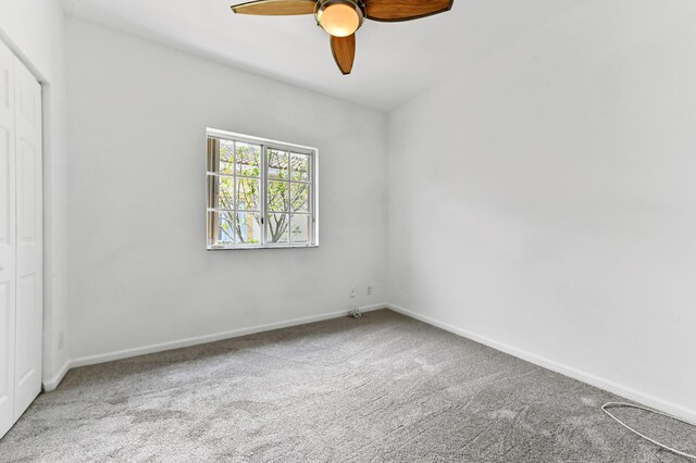 9827 Galleon Dr, West Palm Beach, FL 33411 - empty room with baseboards, ceiling fan, and carpet floors