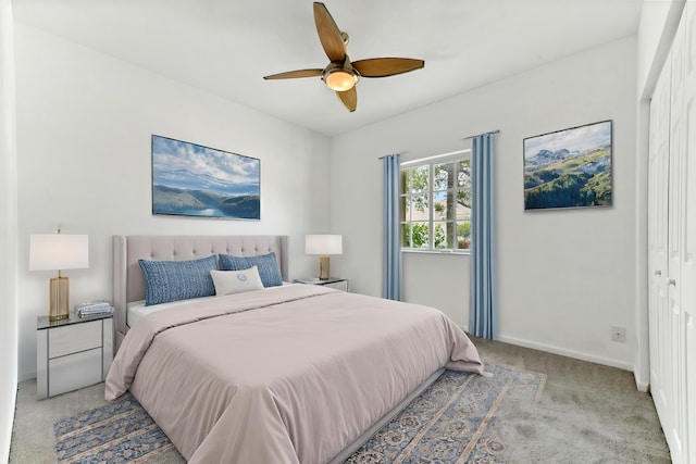 9827 Galleon Dr, West Palm Beach, FL 33411 - bedroom featuring light colored carpet, baseboards, and a ceiling fan