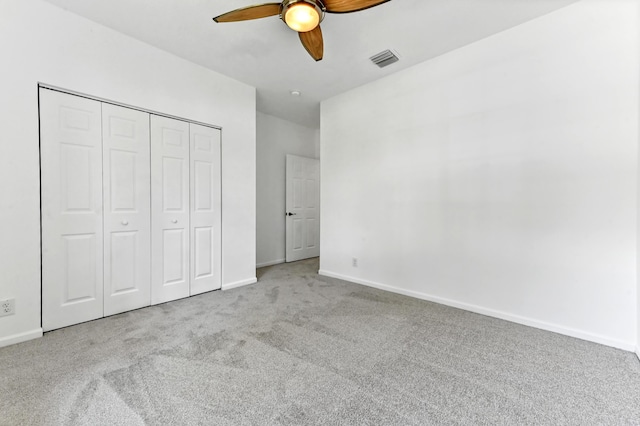 9827 Galleon Dr, West Palm Beach, FL 33411 - unfurnished bedroom featuring carpet, visible vents, baseboards, and a closet
