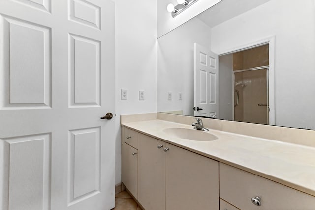 9827 Galleon Dr, West Palm Beach, FL 33411 - bathroom featuring tile patterned floors, a shower stall, and vanity