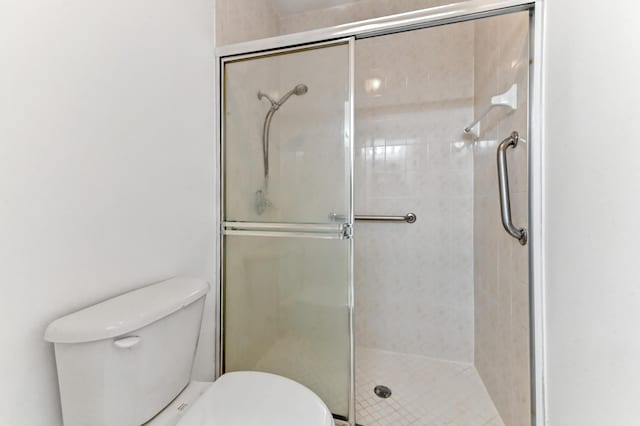 9827 Galleon Dr, West Palm Beach, FL 33411 - bathroom featuring toilet and a stall shower