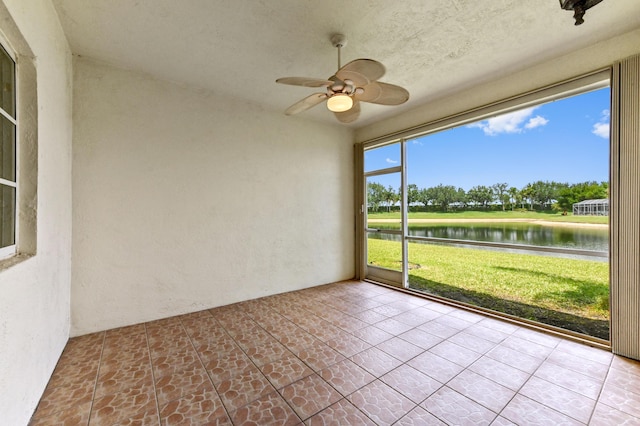 9827 Galleon Dr, West Palm Beach, FL 33411 - unfurnished sunroom with a water view