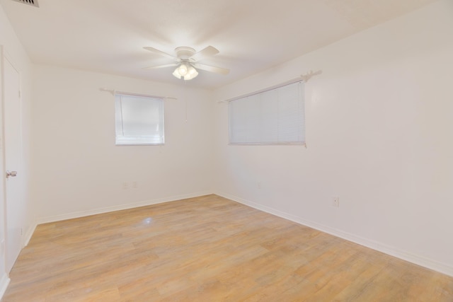 4375 Forest Ln, Palm Springs, FL 33406 - spare room with a ceiling fan, light wood-style flooring, and baseboards
