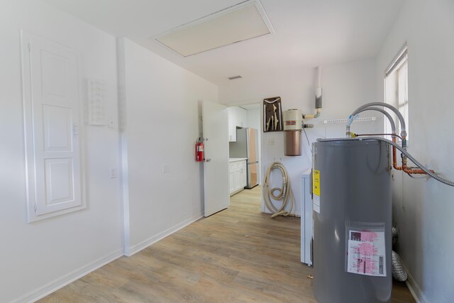 4375 Forest Ln, Palm Springs, FL 33406 - utility room with water heater and a central vacuum unit