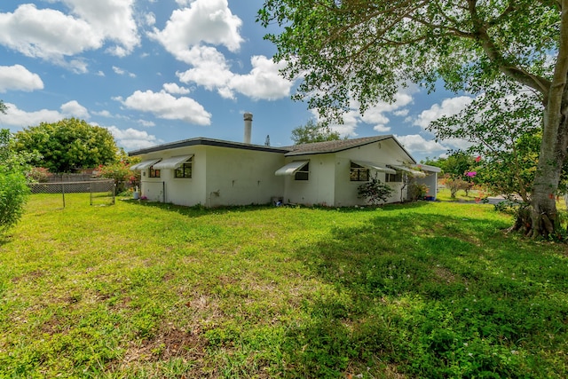 4375 Forest Ln, Palm Springs, FL 33406 - back of property featuring stucco siding