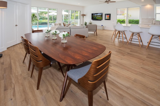 dining space featuring light wood finished floors, recessed lighting, and a ceiling fan