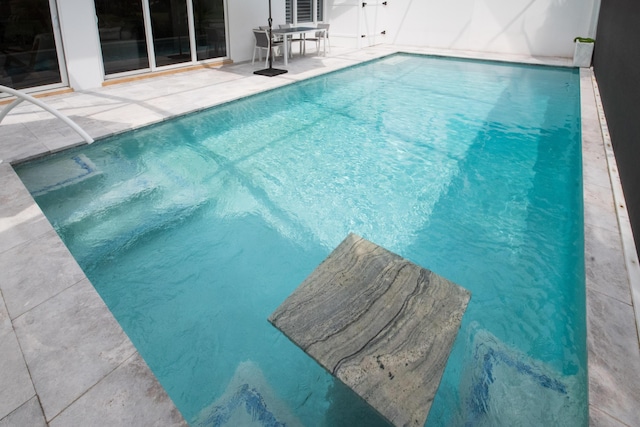 pool with a patio