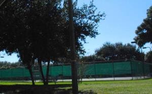 exterior space with fence and a lawn