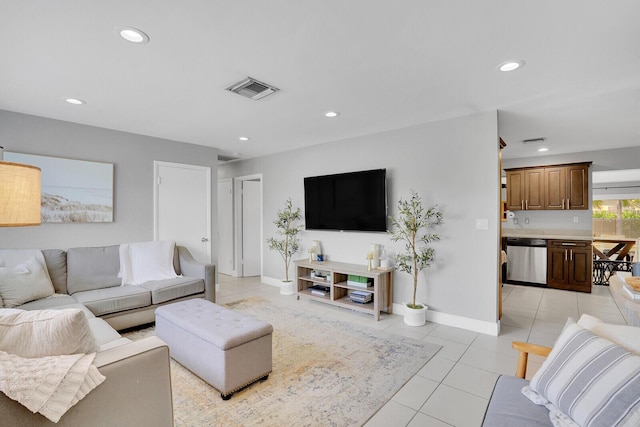 living area with baseboards, visible vents, recessed lighting, and light tile patterned floors