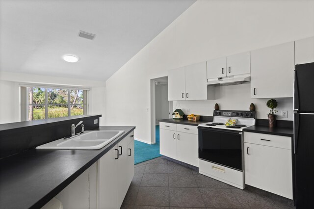 kitchen featuring a sink, freestanding refrigerator, electric range oven, under cabinet range hood, and visible vents