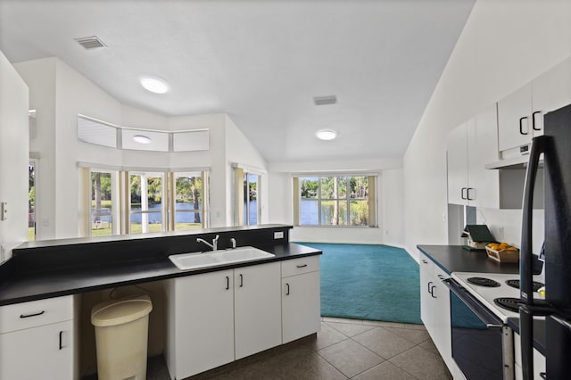 kitchen featuring a sink, white range with electric stovetop, open floor plan, under cabinet range hood, and dark countertops