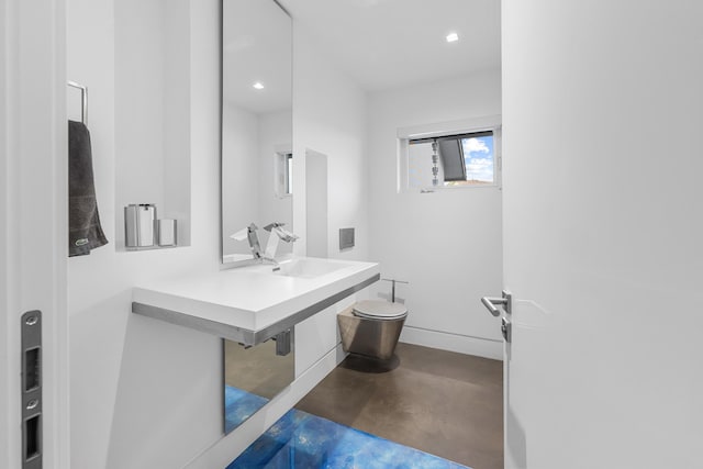 7047 San Sebastian Cir, Boca Raton, FL 33433 - bathroom featuring finished concrete flooring, toilet, a sink, recessed lighting, and baseboards