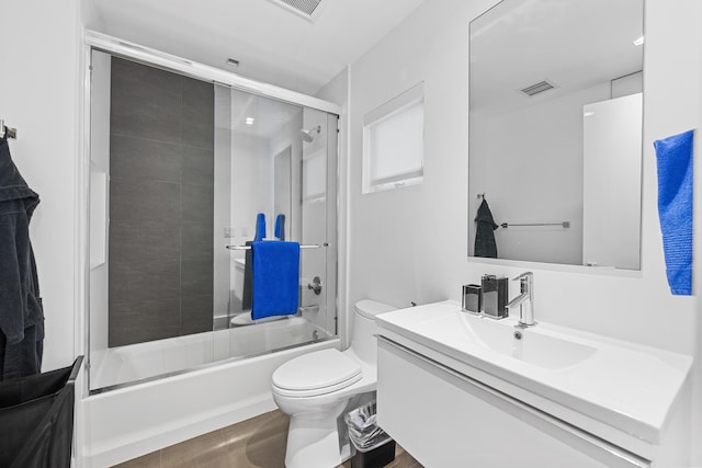 7047 San Sebastian Cir, Boca Raton, FL 33433 - bathroom featuring vanity, toilet, and combined bath / shower with glass door