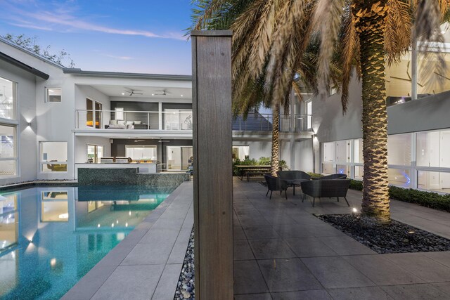 7047 San Sebastian Cir, Boca Raton, FL 33433 - swimming pool with ceiling fan, a patio, and an outdoor living space