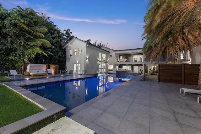 7047 San Sebastian Cir, Boca Raton, FL 33433 - pool at dusk with an outdoor pool, a patio area, and outdoor lounge area