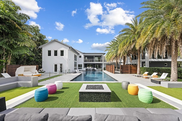7047 San Sebastian Cir, Boca Raton, FL 33433 - swimming pool with an outdoor living space with a fire pit, an outdoor kitchen, and a patio