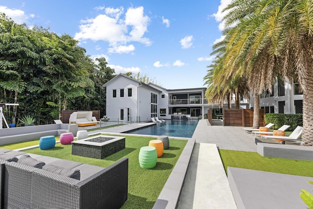 7047 San Sebastian Cir, Boca Raton, FL 33433 - outdoor pool featuring a patio and an outdoor living space with a fire pit