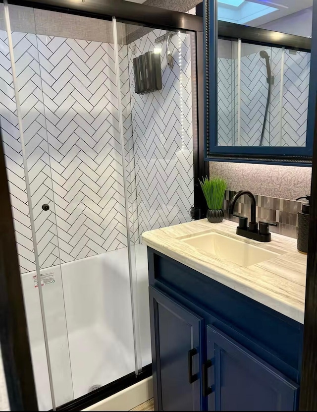 bathroom with vanity and an enclosed shower