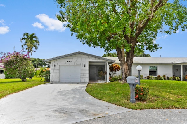 6472 Overland Dr, Delray Beach, FL 33484 - ranch-style home featuring an attached garage, concrete block siding, driveway, and a front yard