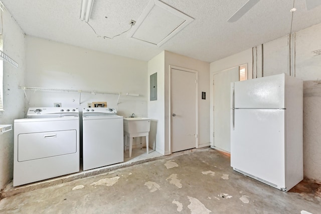 6472 Overland Dr, Delray Beach, FL 33484 - clothes washing area featuring electric panel, a sink, laundry area, a textured ceiling, and independent washer and dryer