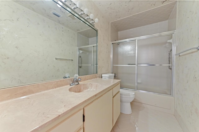 6472 Overland Dr, Delray Beach, FL 33484 - full bathroom with toilet, tile patterned floors, vanity, and shower / bath combination with glass door