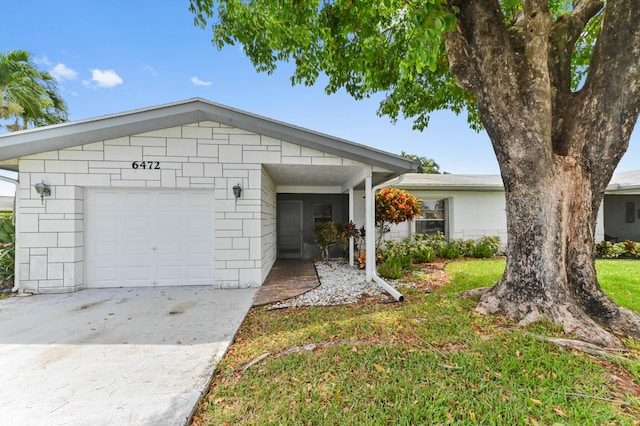 6472 Overland Dr, Delray Beach, FL 33484 - single story home featuring driveway, concrete block siding, and a garage