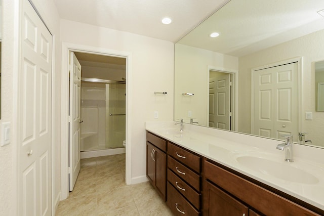 6763 Mar Pacifico, Fort Pierce, FL 34950 - bathroom featuring double vanity, a sink, a stall shower, and toilet