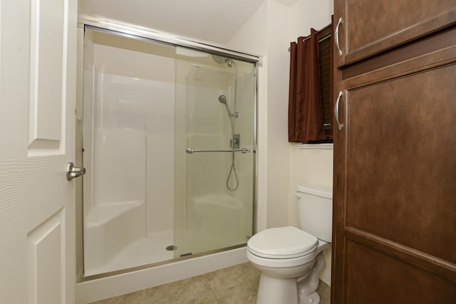 6763 Mar Pacifico, Fort Pierce, FL 34950 - full bathroom with toilet, a stall shower, and tile patterned flooring