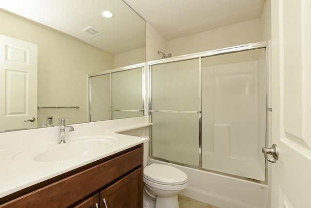 6763 Mar Pacifico, Fort Pierce, FL 34950 - bathroom featuring combined bath / shower with glass door, toilet, vanity, visible vents, and recessed lighting