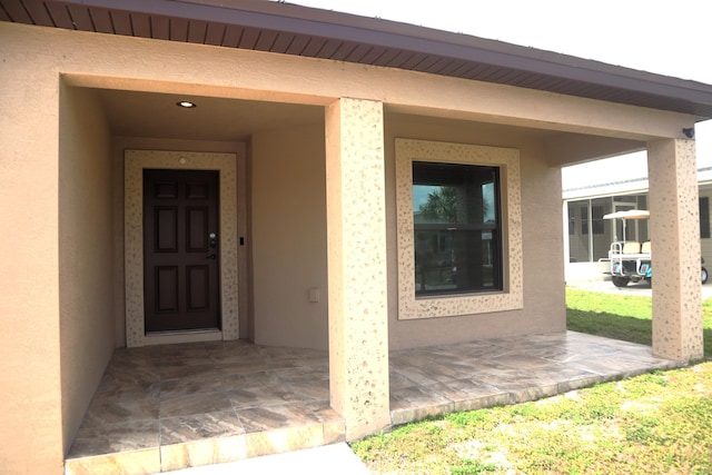 6763 Mar Pacifico, Fort Pierce, FL 34950 - doorway to property featuring stucco siding