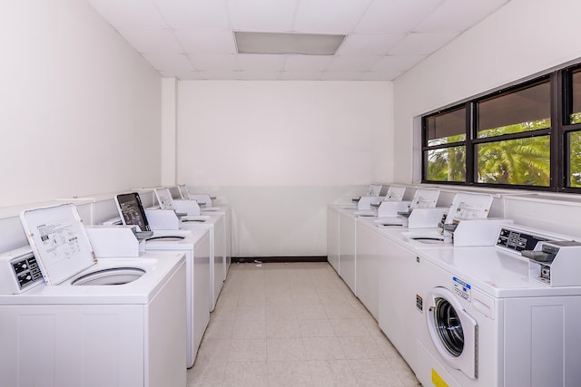 6763 Mar Pacifico, Fort Pierce, FL 34950 - community laundry room with washing machine and clothes dryer and baseboards
