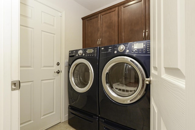 6763 Mar Pacifico, Fort Pierce, FL 34950 - laundry area featuring washer and clothes dryer and cabinet space