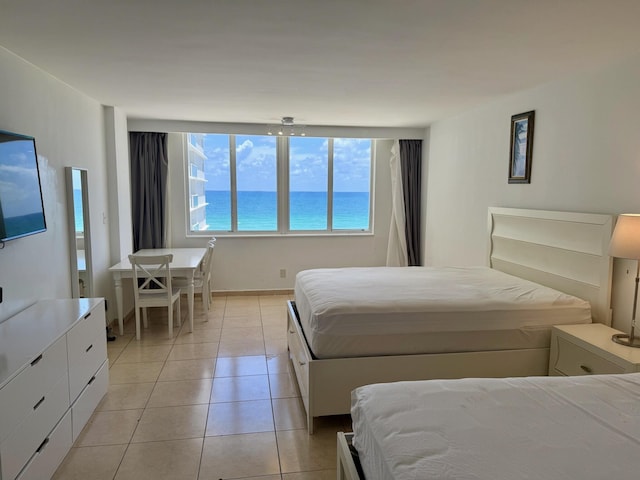 19201 Collins Ave Unit 448, Sunny Isles Beach, FL 33160 - bedroom featuring light tile patterned floors and a water view
