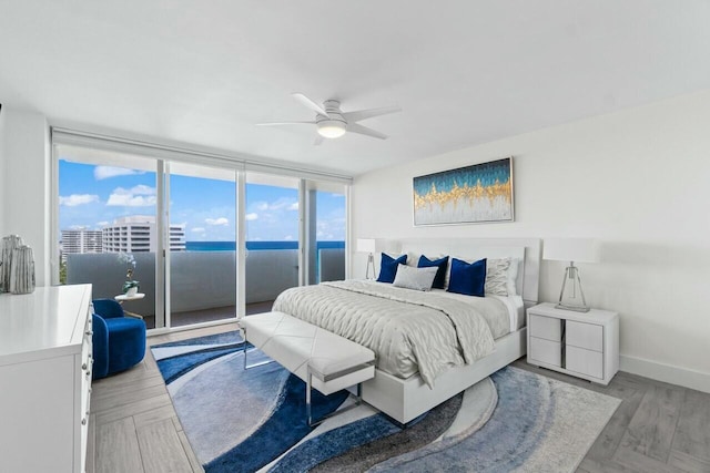 bedroom featuring baseboards, access to outside, and ceiling fan