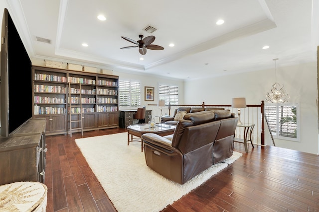 12479 Aviles Cir, Palm Beach Gardens, FL 33418 - living room with a tray ceiling, ceiling fan, a chandelier, dark wood finished floors, and recessed lighting