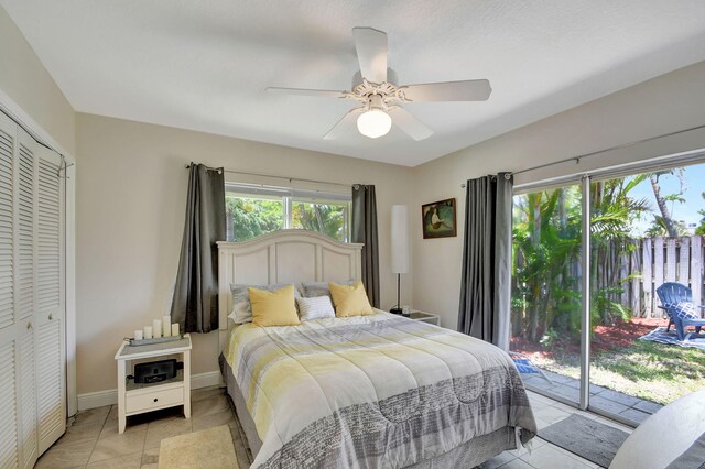3412 Lake Osborne Dr, Lake Worth Beach, FL 33461 - workout area featuring ceiling fan, tile patterned floors, and a textured ceiling