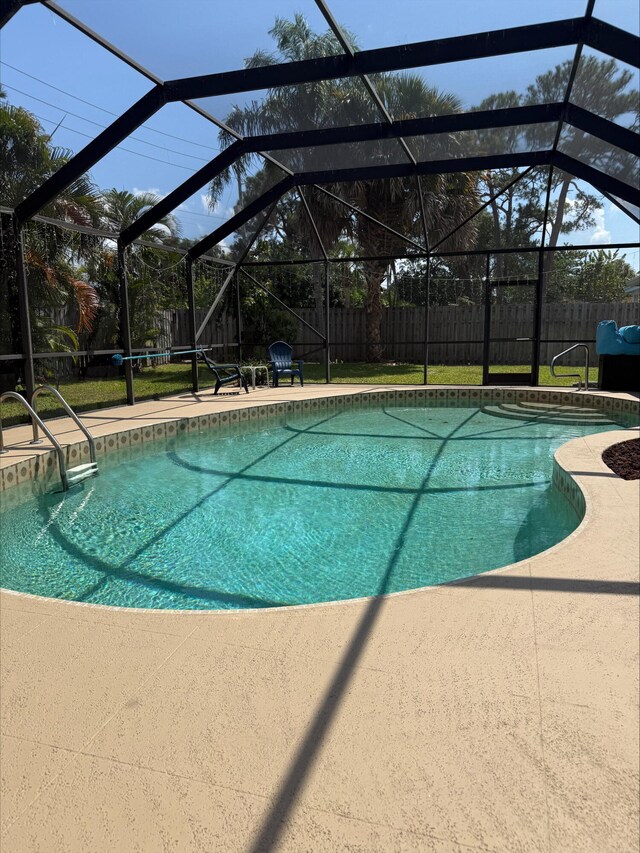 3412 Lake Osborne Dr, Lake Worth Beach, FL 33461 - view of swimming pool with a patio area, glass enclosure, and a fenced backyard