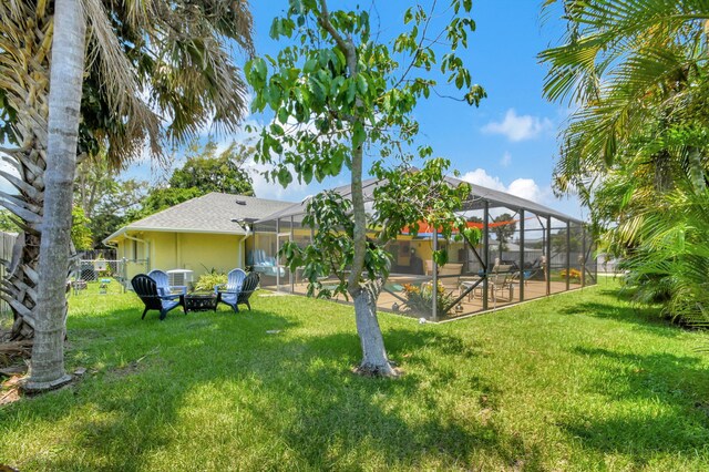 3412 Lake Osborne Dr, Lake Worth Beach, FL 33461 - fenced backyard featuring a lanai and a fire pit