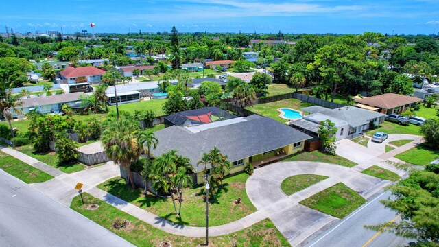 3412 Lake Osborne Dr, Lake Worth Beach, FL 33461 - view of front of property with stucco siding, an attached garage, concrete driveway, and roof with shingles
